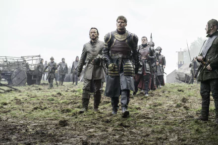 Bronn (Jerome Flynn) and Jaime Lannister (Nikolaj Coster-Waldau) from Game of Thrones, walking through a muddy battlefield in a 4K Ultra HD TV show wallpaper.