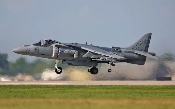 McDonnell Douglas AV-8B Harrier II military jet captured mid-landing, featured as an HD PC desktop wallpaper and background.