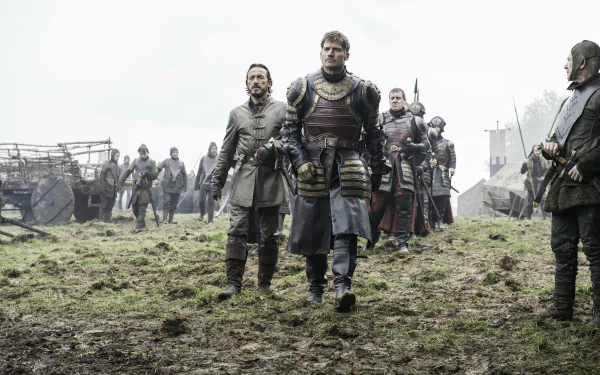 Bronn (Jerome Flynn) and Jaime Lannister (Nikolaj Coster-Waldau) from Game of Thrones, walking through a muddy battlefield in a 4K Ultra HD TV show wallpaper.