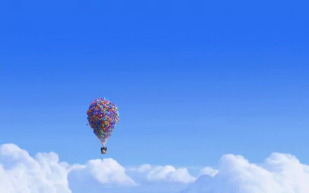 HD PC desktop wallpaper featuring a scene from the 2009 movie Up, showing the house lifted by colorful balloons floating above the clouds against a bright blue sky.
