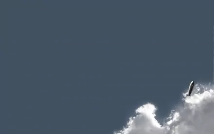A sleek aircraft ascends through fluffy clouds against a clear blue sky, creating a striking HD PC desktop wallpaper and background.