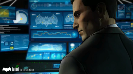 HD PC desktop wallpaper of Bruce Wayne/Batman from the video game Batman: The Telltale Series — profile shot in the Batcave with blue-lit computer consoles.