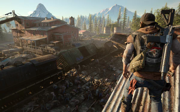 HD desktop wallpaper from the video game Days Gone, showing a character overlooking a post-apocalyptic landscape with a train yard and mountains in the background.