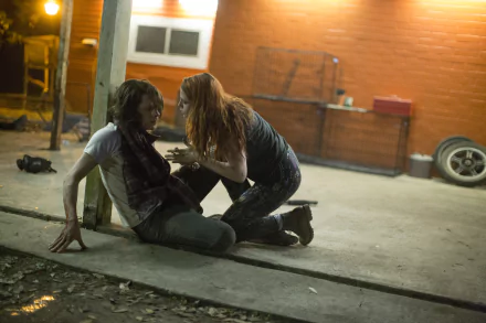 Kristen Stewart and Jesse Eisenberg in a tense scene from the movie American Ultra, shown in a 4K Ultra HD PC desktop wallpaper style.