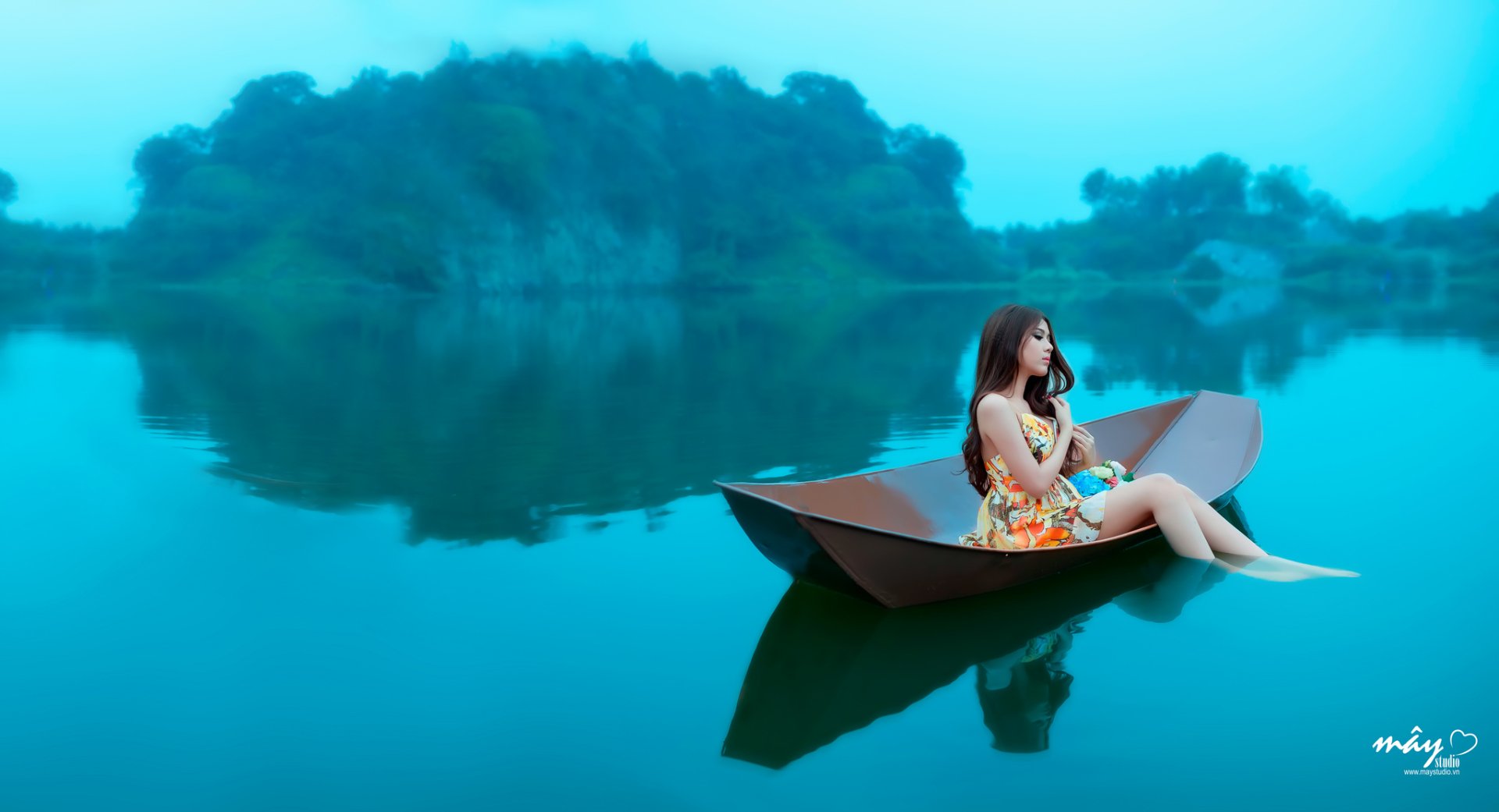 Tranquil Moments: HD Wallpaper of an Asian Woman on Calm Waters