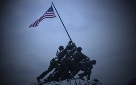 HD desktop wallpaper depicting the iconic United States Marine Corps (USMC) statue, showing Marines raising an American flag, symbolizing patriotism and military valor.