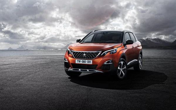 Orange Peugeot 3008 SUV parked on a beach with a cloudy sky backdrop, captured in sharp detail as a 4K Ultra HD desktop wallpaper.