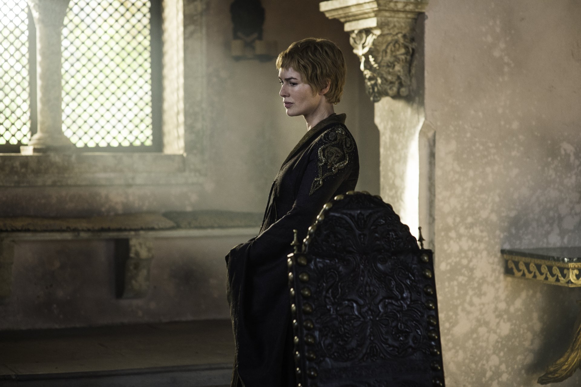 Lena Headey as Cersei Lannister from Game of Thrones, captured in a 4K Ultra HD PC desktop wallpaper showing her seated in a dimly lit room with ornate decor.