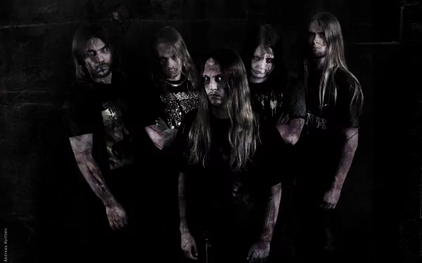 HD PC desktop wallpaper featuring the metal band Bloodbath in a dark, moody setting, emphasizing their intense music style and brooding presence.