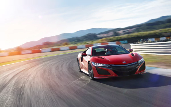 Red Honda NSX sports car racing a curving track with motion blur and sunset light, dynamic 4K Ultra HD PC desktop wallpaper background.