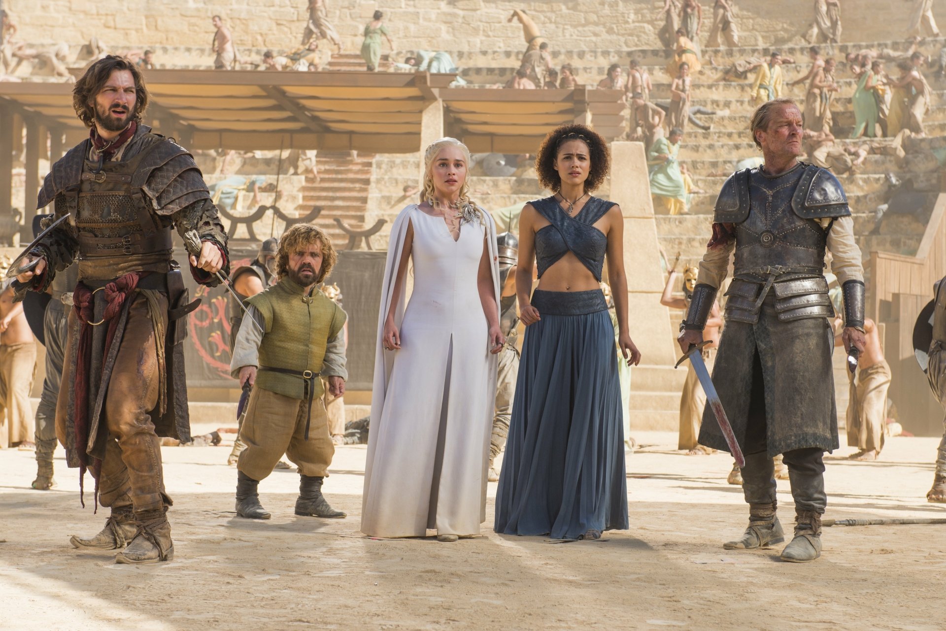 A striking HD wallpaper featuring key characters from Game of Thrones: Daenerys Targaryen, Missandei, Tyrion Lannister, Daario Naharis, and Jorah Mormont in a dramatic scene.