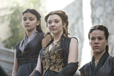Margaery Tyrell, portrayed by Natalie Dormer, stands confidently with two other women in a scene from the TV show Game of Thrones, captured in 4K Ultra HD quality.