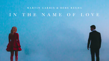 HD desktop wallpaper featuring Bebe Rexha and Martin Garrix for their song In the Name of Love. The image shows both artists standing apart against a blue misty background with the song title above them.