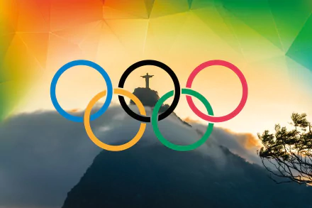 HD desktop wallpaper featuring the Olympic rings over a scenic view of Rio de Janeiro's Christ the Redeemer statue during the 2016 Summer Olympic Games.