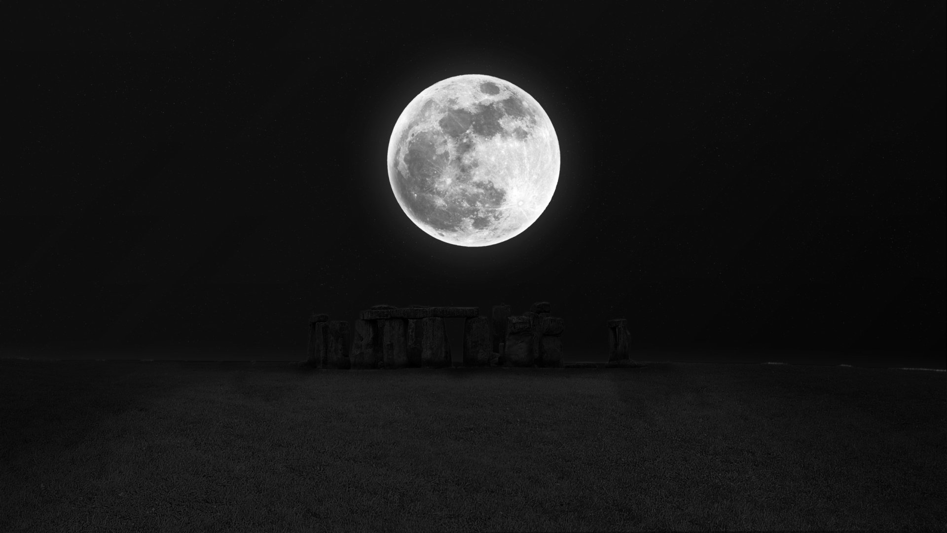 HD desktop wallpaper of Stonehenge at night, illuminated by a bright full moon against a dark sky, showcasing nature’s serene and mystical beauty.