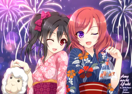 HD anime wallpaper featuring Nico Yazawa and Maki Nishikino from Love Live! in colorful yukatas with fireworks lighting up the night sky behind them.