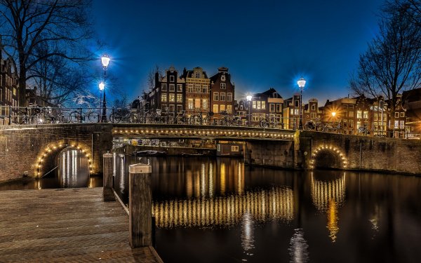 Man Made Amsterdam Cities Netherlands Canal Bridge Night Light Bicycle HD Wallpaper | Background Image
