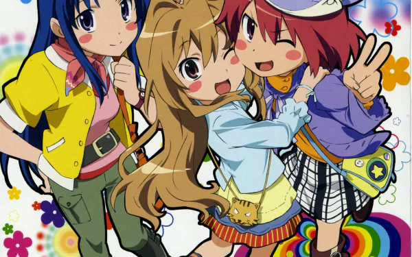 HD anime desktop wallpaper featuring Minori Kushieda, Taiga Aisaka, and Ami Kawashima from Toradora! in a colorful, playful background.