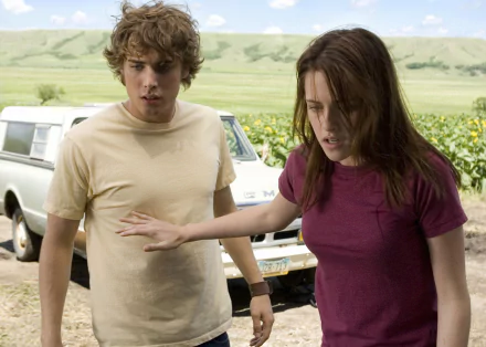 HD desktop wallpaper featuring Kristen Stewart and a co-star in a scene from the movie The Messengers, set against a rural landscape with a white pickup truck.