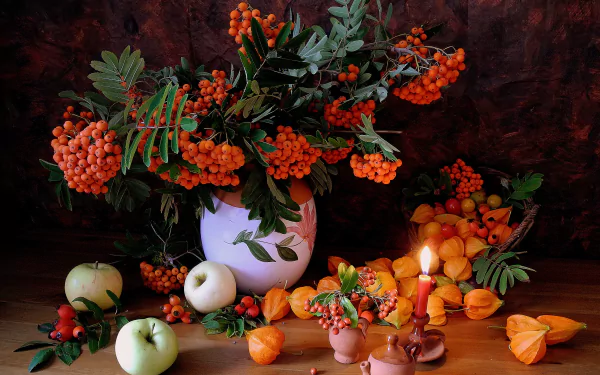 A vibrant still life featuring a vase filled with orange berries and leafy branches, surrounded by apricots, apples, and a candle, set against a warm wooden backdrop.