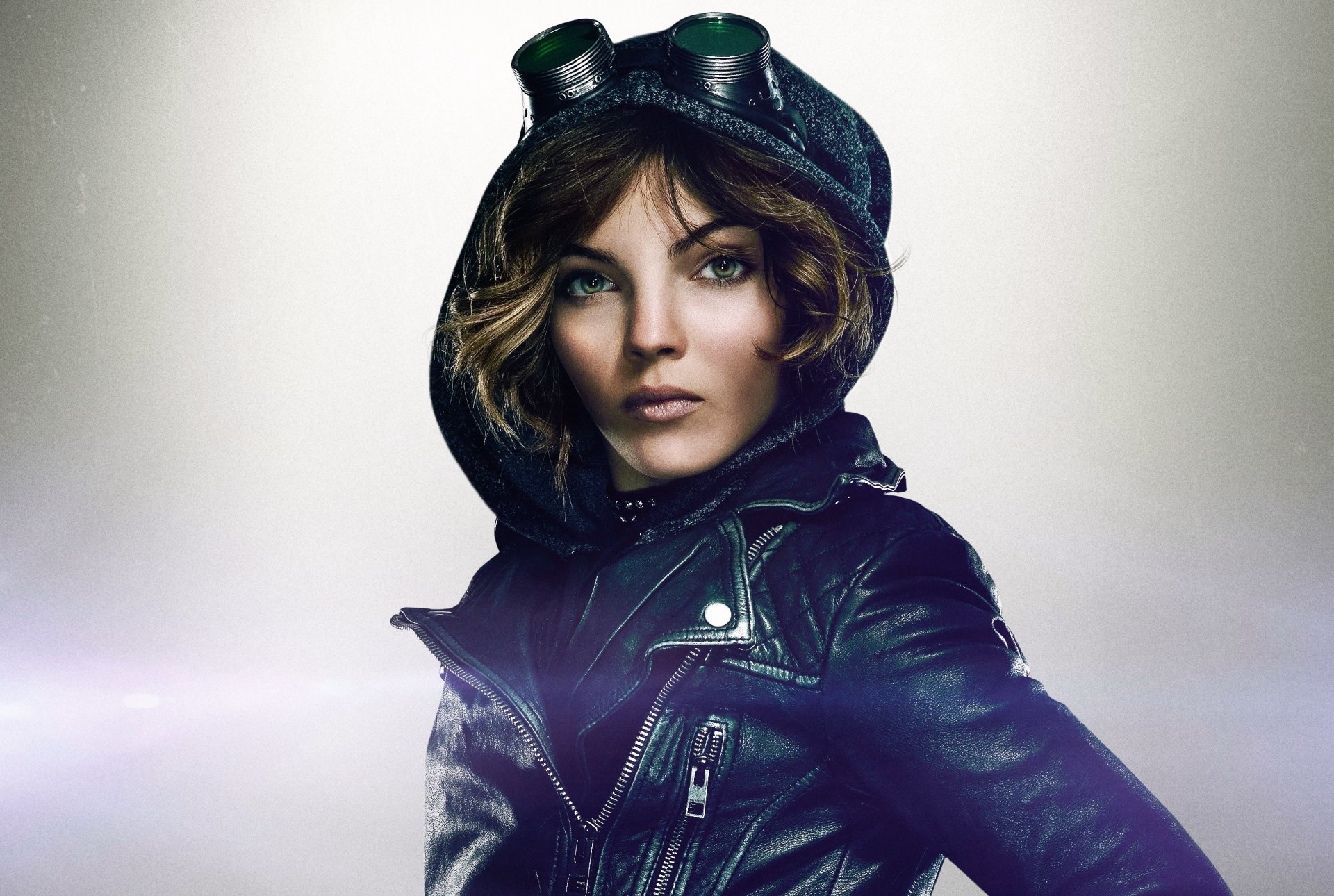HD desktop wallpaper of Camren Renee Bicondova as Selina Kyle/Catwoman from the Gotham TV show, featuring her in a black leather jacket and goggles.