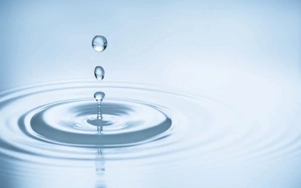 Artistic, elemental close-up of water droplets creating ripples, rendered in stunning 4K Ultra HD for a serene PC desktop wallpaper and background.