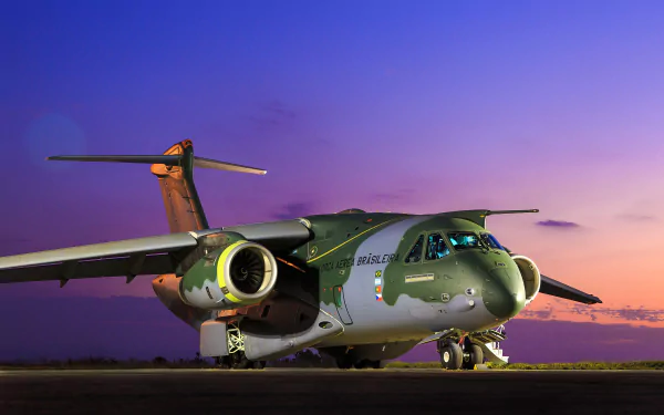 A striking Embraer KC-390 transport aircraft sits on the tarmac, showcasing its sleek design against a vibrant sunset, embodying modern military aviation.