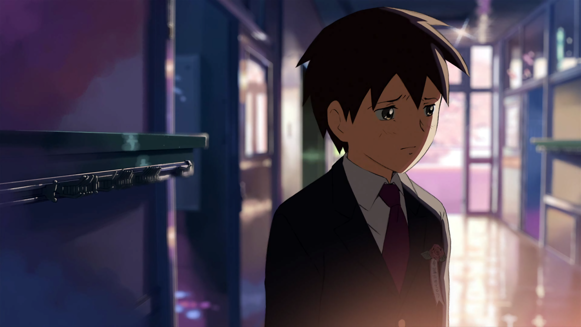 HD anime wallpaper featuring Takaki Touno from 5 Centimeters per Second, standing thoughtfully in a softly lit corridor with a moody, reflective atmosphere.
