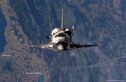 A stunning HD wallpaper featuring the Space Shuttle Discovery soaring above Earth, showcasing intricate details of the shuttle against a vibrant landscape below.