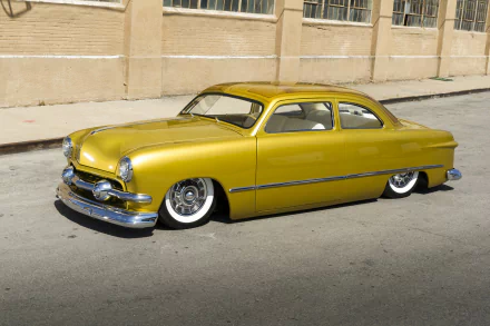 A vibrant yellow lowrider 1951 Ford Custom hot rod parked on a street, featured as an HD PC desktop wallpaper and background.