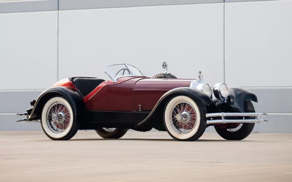 Vintage 1924 Duesenberg Model A Speedster with sleek black and red body, whitewall tires, and classic chrome detailing, showcased as an HD PC desktop wallpaper.