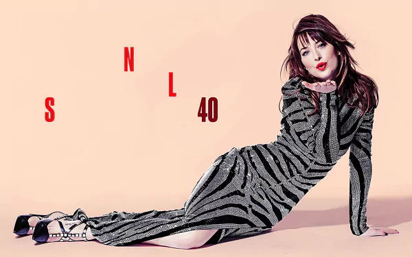 HD desktop wallpaper featuring Dakota Johnson posing against a light background with SNL 40 text, referencing the Saturday Night Live TV show anniversary.