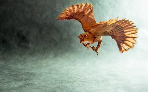 A stunning HD desktop wallpaper featuring a man-made origami bird, intricately designed to resemble a soaring hawk against a soft, textured background.