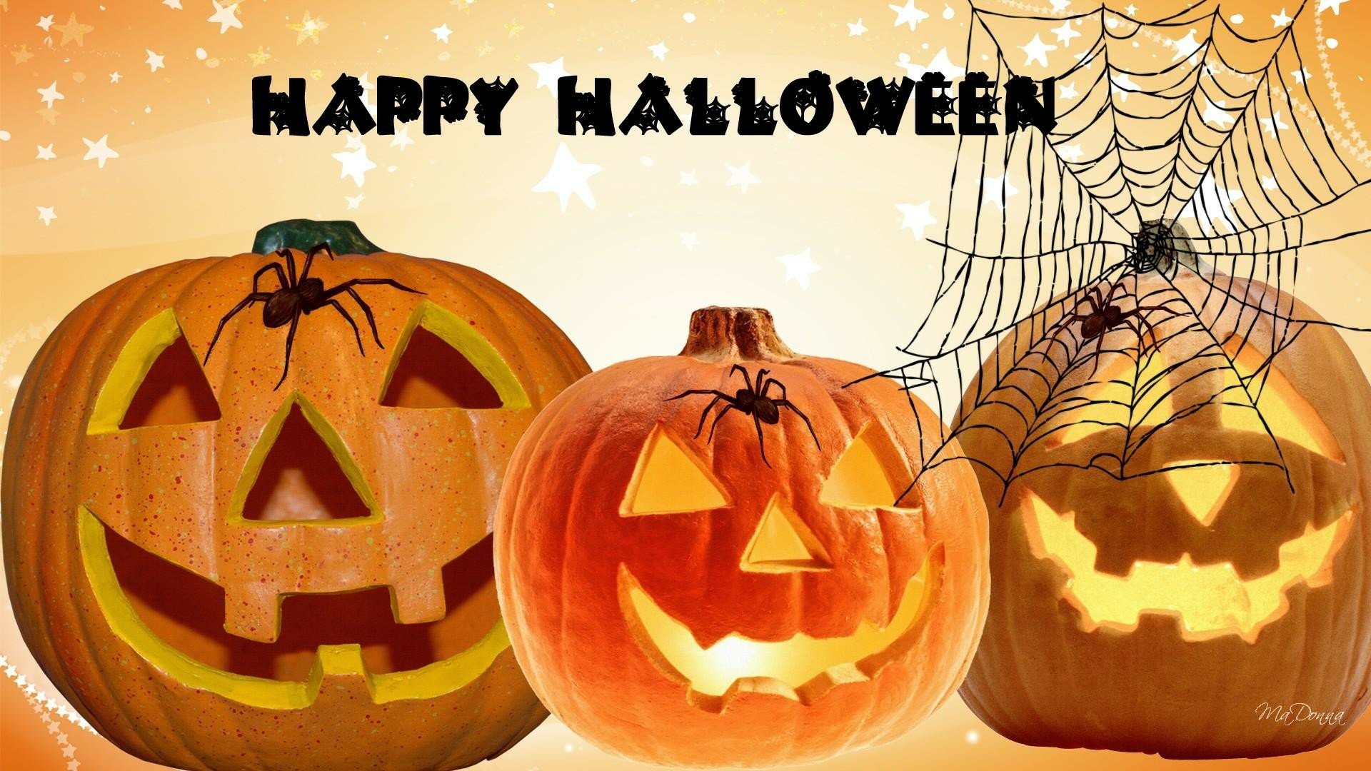 HD desktop wallpaper featuring three glowing jack-o'-lanterns with spiders and a spider web, framed by a Happy Halloween greeting against an orange background.