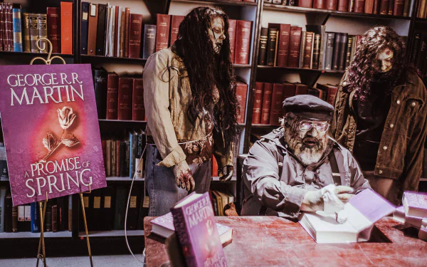 A zombie-themed HD desktop wallpaper from the TV show Z Nation, featuring zombie characters in a library setting, with a prominent book by George R.R. Martin in the foreground.