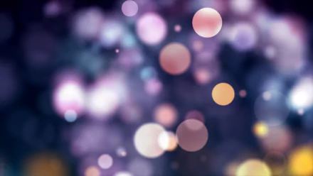 A vibrant, artistic bokeh image featuring blurred circles in shades of purple and soft light, designed for a 4K Ultra HD desktop wallpaper background.