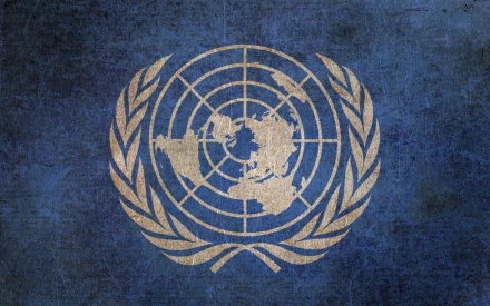 A textured blue background featuring the United Nations emblem, designed as a high-definition desktop wallpaper.