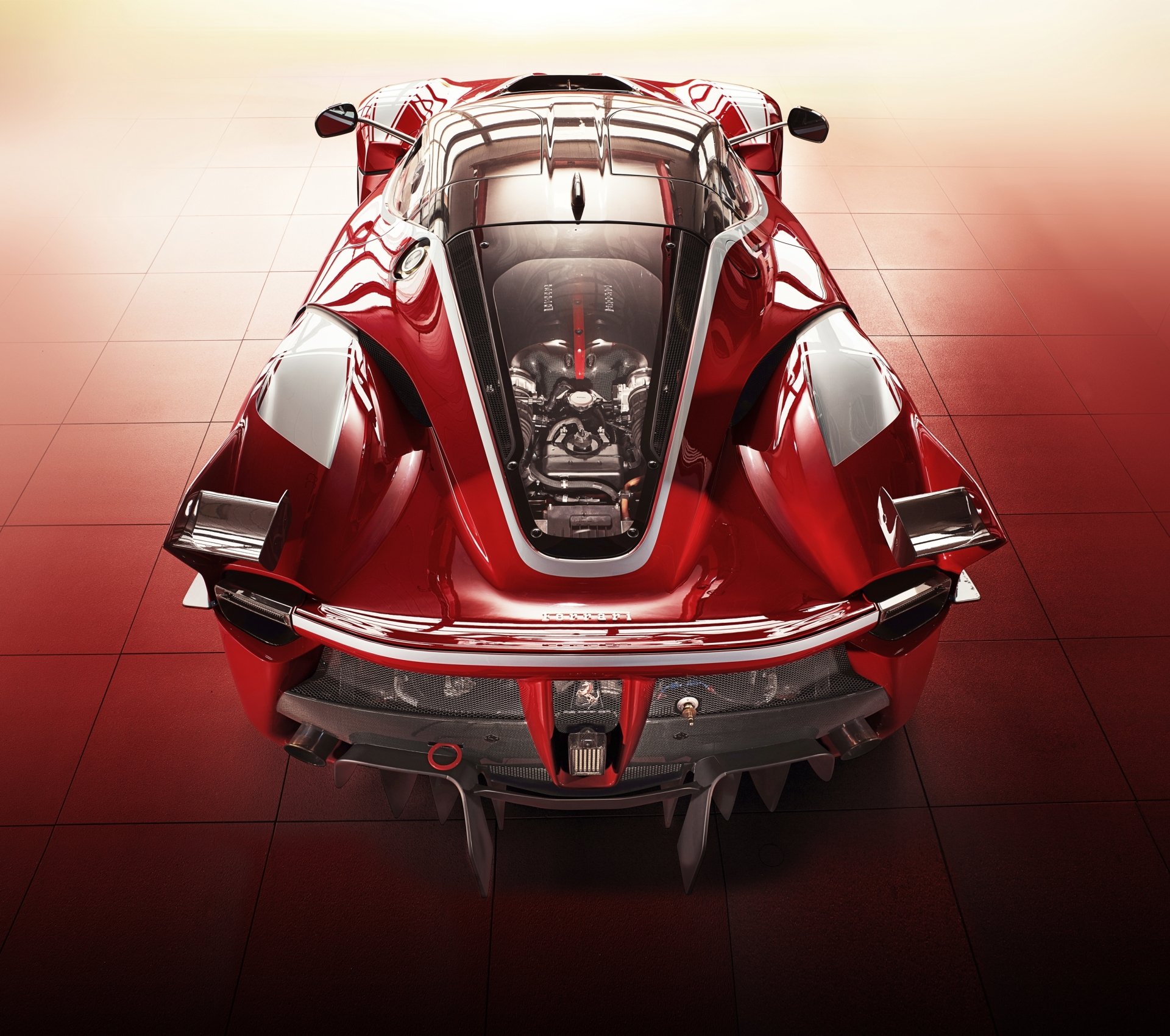 Top-down view of a red Ferrari FXX K on glossy tiles, high-detail 2K Quad HD PC desktop wallpaper/background.