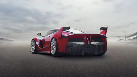 Red Ferrari FXX K racing car on a foggy track seen from the rear, high-detail 2K Quad HD PC desktop wallpaper/background.