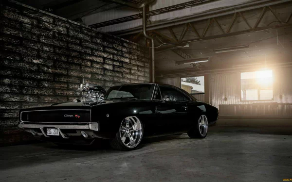 HD PC desktop wallpaper featuring a sleek black hot rod parked in a dimly lit industrial garage with sunlight streaming through a window.