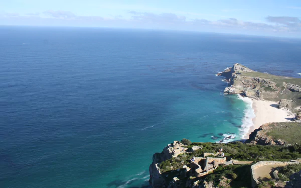 4K Ultra HD PC desktop wallpaper and background: South Africa coastline — expansive ocean, sandy bay and rugged cliffs in a dramatic nature landscape.