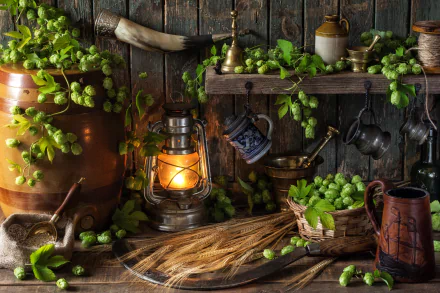 A still life image featuring hops, wheat, and a lantern set against a rustic wooden background, showcasing vibrant greenery and vintage utensils in 4K Ultra HD quality.