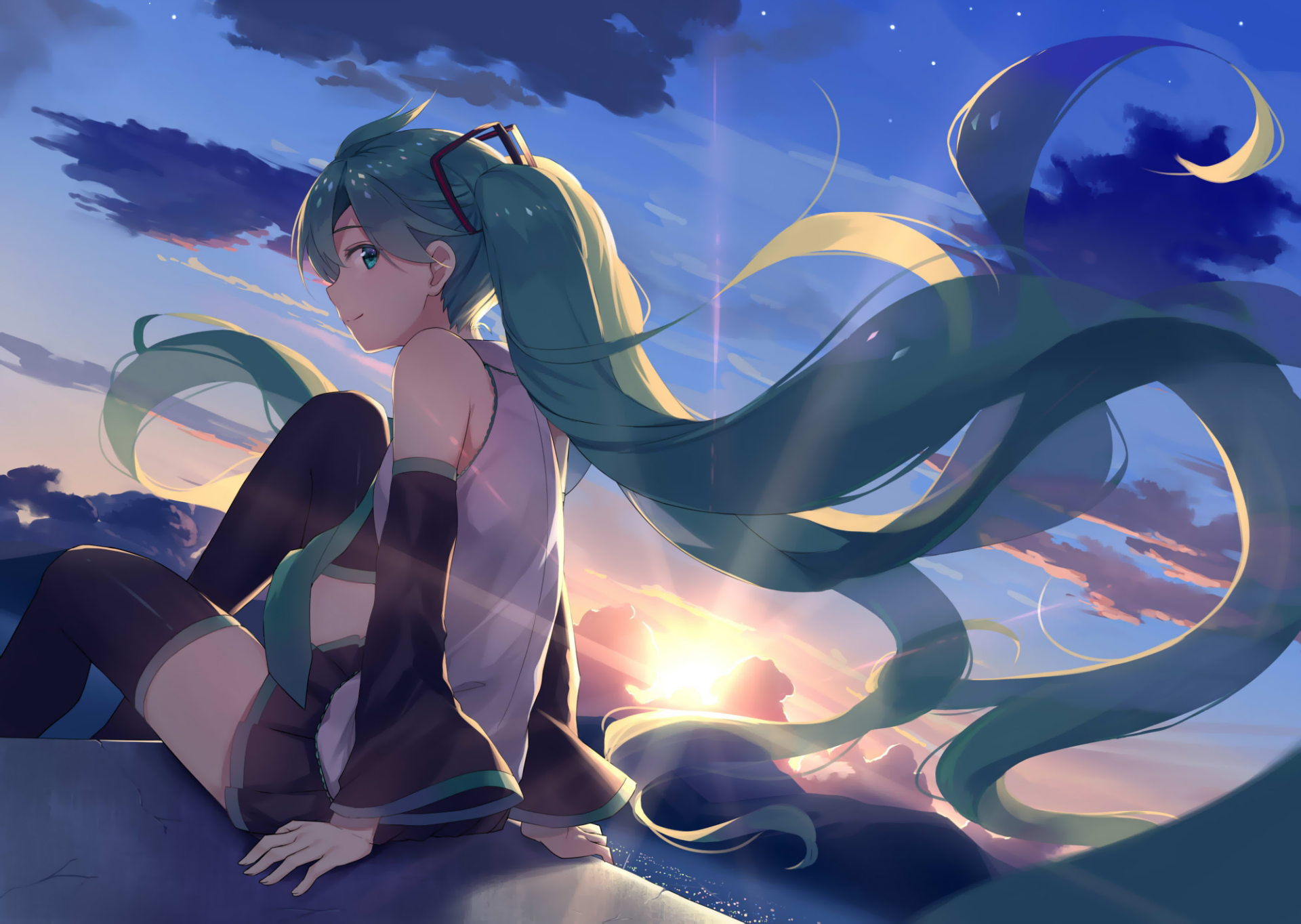 Anime-style HD desktop wallpaper featuring Hatsune Miku with long green twintails and green eyes, sitting in a skirt against a vivid sunset sky.