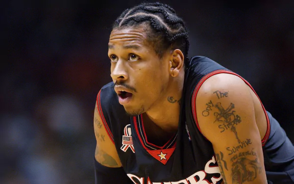 HD desktop wallpaper featuring a focused player mid-game, sporting a black jersey with red accents.