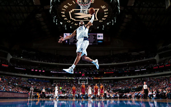 A high-definition desktop wallpaper featuring Allen Iverson in mid-air during a dynamic basketball game, capturing the energy of sports and the excitement of the arena.