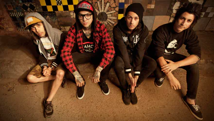 HD wallpaper of Pierce the Veil band members sitting against a checkered backdrop.