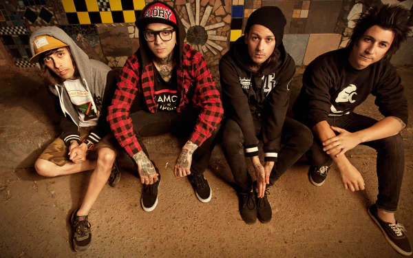 HD wallpaper of Pierce the Veil band members sitting against a checkered backdrop.