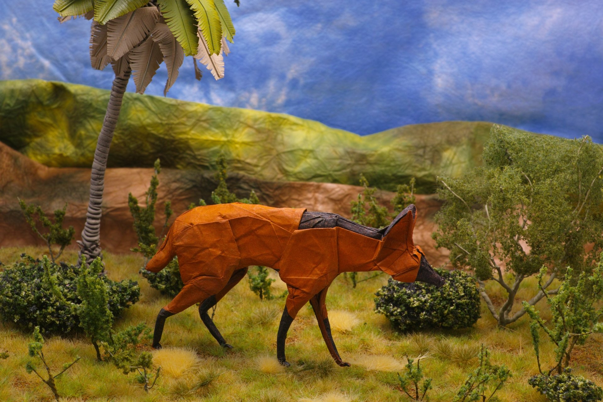 A man-made origami fox set in a detailed natural landscape, rendered as a vibrant 4K Ultra HD PC desktop wallpaper background.