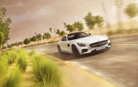 White Mercedes-AMG GT captured in motion blur speeding along a scenic road, creating a dynamic HD PC desktop wallpaper and background.