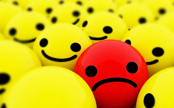 HD desktop wallpaper featuring numerous yellow smiley faces with one red face showing a sad expression amidst them.